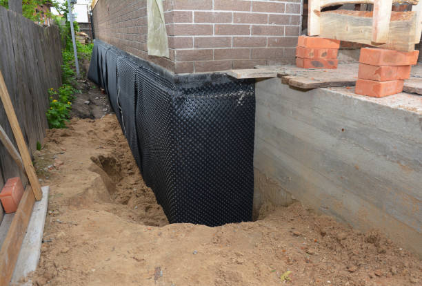 Happy homeowners after waterproofing job in Iberia